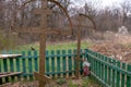 Photography to theme old grave with cross during Ukraine war