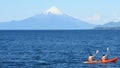 People paddling kayak at a lake in the south of Chile Royalty Free Stock Photo