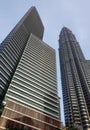 a photography of two tall buildings with a sky background, palace towers in a city with a blue sky in the background Royalty Free Stock Photo