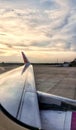 a photography of a view of a wing from a plane, view of a wing of an airplane on a runway