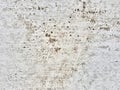 a photography of a white wall with a lot of dirt on it, nail holes in the concrete wall of a building Royalty Free Stock Photo