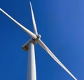 a photography of a wind turbine with a blue sky in the background, electric fan on a wind turbine against a blue sky Royalty Free Stock Photo