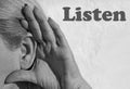 Photography of woman ear making listening gesture with her hand with word Listen Royalty Free Stock Photo