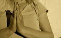 Photography of woman making praying gesture with her hands