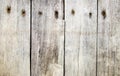 a photography of a wooden fence with a bunch of rusted nails, wood planks with nails and nails on them Royalty Free Stock Photo
