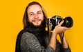 Photojournalist. Bearded man with photo camera. Stylish photographer with Retro Vintage camera.