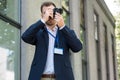 photojournalist in formal wear with press pass