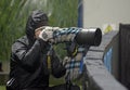 Photojournalist work in bad weather conditions Royalty Free Stock Photo