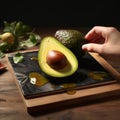 Photorealistic Avocado Slice On Black Plate With Isolated White Background Royalty Free Stock Photo