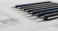 Plotter pens lined by nib size, no numbers, on a mockup sheet with abstract lines Royalty Free Stock Photo