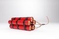 Photorealistic image of a bunch of sticks of dynamite on a light background. Copy space, 3D illustration, 3D render