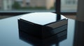 A photorealistic image of a glossy black hexagonal box with sharp edges and clean design