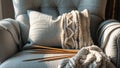 Photorealistic image of a knitting needles on cozy chair Royalty Free Stock Photo