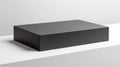 A photorealistic image of a large rectangular black box with a matte finish and sharp edges Royalty Free Stock Photo