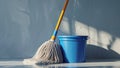 Photorealistic image of a mop leaning beside water bucket Royalty Free Stock Photo