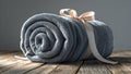 Photorealistic image of a rolled grey towel with ribbon Royalty Free Stock Photo