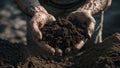 Photorealistic image of a weathered hands holding soil Royalty Free Stock Photo