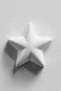 Photorealistic White Ceramic Star on Light Grey Background Royalty Free Stock Photo