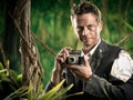 Photoreporter Walking In The Jungle With Vintage Camera