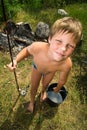 Photos of the boy with a bucket and a fishing rod