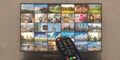 Photos collage on TV screen and television remote control. 3d illustration