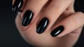 Photos of the design of black nails on the hands, advertising the color of the nails