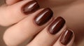 Photos of the design of brown nails on the hands, advertising the color of the nails Royalty Free Stock Photo