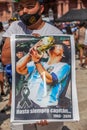 Photos, drawings, posters with a portrait of Diego Maradona in the hands of fans on the day of farewell to the idol Royalty Free Stock Photo