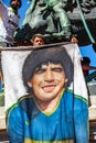 Photos, drawings, posters with a portrait of Diego Maradona in the hands of fans on the day of farewell to the idol Royalty Free Stock Photo