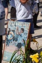 Photos, drawings, posters with a portrait of Diego Maradona in the hands of fans on the day of farewell to the idol Royalty Free Stock Photo