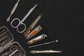 Flat lay, top view manicure pedicure equipment on black background