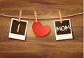 Photos hanging on a clothesline, spelling out I love mom. Mother