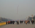 Photos with landscape background strolling tourists and locals, albeit a traditional kite