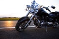 Bikers man and woman stopped at the side of the road to rest and kiss passionately. Photos of loving motorcyclists at sunset. The Royalty Free Stock Photo