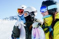 Photos of three snowboarders looking in direction of winter resort