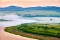 The morning fog on the river in meadows sunrise Royalty Free Stock Photo