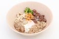 Vietnamese Rice Noodles Soup with soft-boiled eggs, blood pudding, minced pork, in a bowl on white background Royalty Free Stock Photo