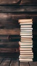PhotoStock Stack of books on wooden board background evokes rustic charm