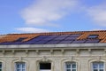 Photovoltaic electrical solar panel on roof top of ancient house Royalty Free Stock Photo