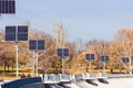 Photovoltaic modules on lampposts in the park in autumn. The concept of cheap electricity using solar panels. Zaporozhye, Ukraine