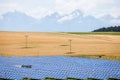 Photovoltaic modules at the yellow field. Royalty Free Stock Photo