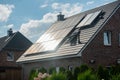 Photovoltaic panels on the tiled roof. Royalty Free Stock Photo