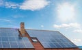 Photovoltaic or solar panels on roof against blue sky Royalty Free Stock Photo