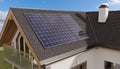 Photovoltaic solar panels on roof of a house producing renewable energy. 3D rendered illustration. Royalty Free Stock Photo