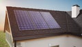 Photovoltaic solar panels on roof of a house producing renewable energy. 3D rendered illustration Royalty Free Stock Photo