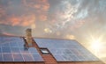 Photovoltaic or solar panels on roof at sunset Royalty Free Stock Photo