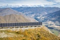 Photovoltaic solar panels on the slope above valley in Mount Aspiring National Park, New Zealand