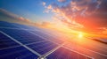 Photovoltaic solar panels on sunset sky background, green clean energy concept. Royalty Free Stock Photo