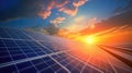 Photovoltaic solar panels on sunset sky background, green clean energy concept. Royalty Free Stock Photo