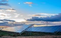 Photovoltaic and wind plant at sunset Royalty Free Stock Photo